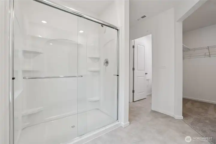 Shower in primary bathroom.   Pictures are for representational purposes only, colors and features may vary.