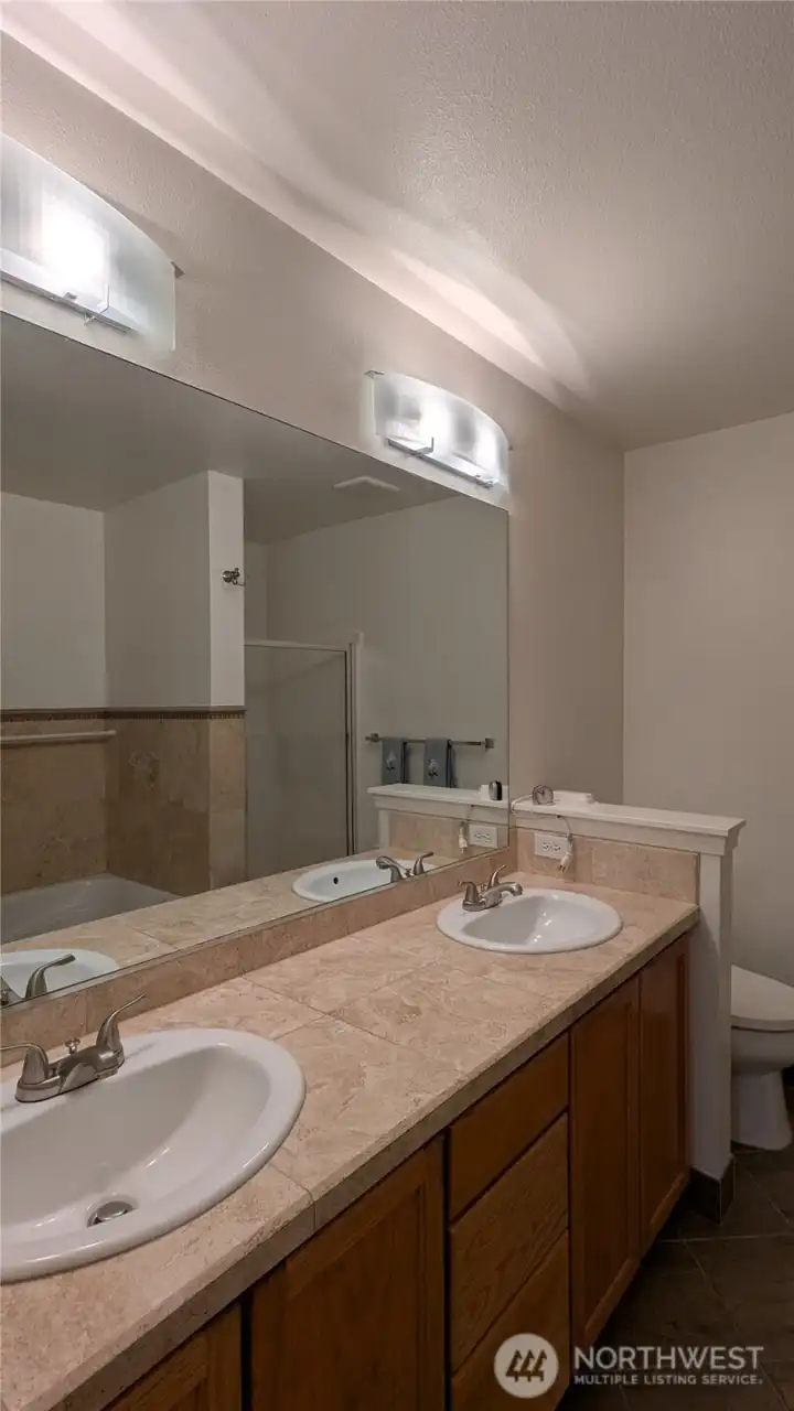 Primary bathroom with separate tub and shower
