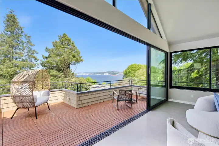 Step outside and watch ships cross Puget Sound from your private upper deck, framed by the park's old-growth trees.
