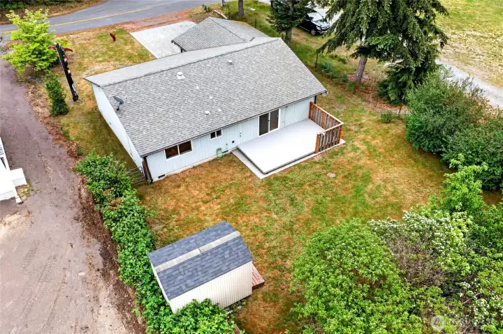 Big back yard and storage shed. Have fun on your back trex deck.