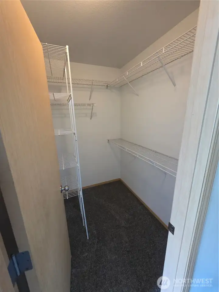 Primary walk-in closet Primary walk-in closet