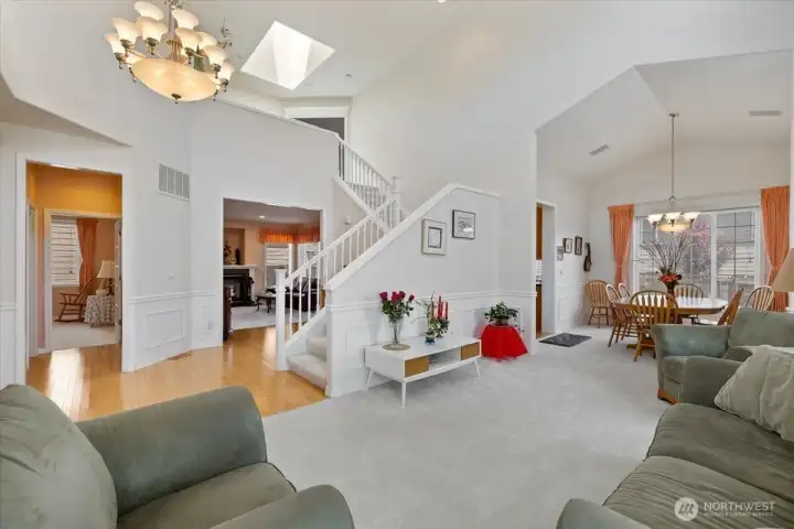 Hall to left leads to MF Office and half bath. Behind staircase is entry to Family Room