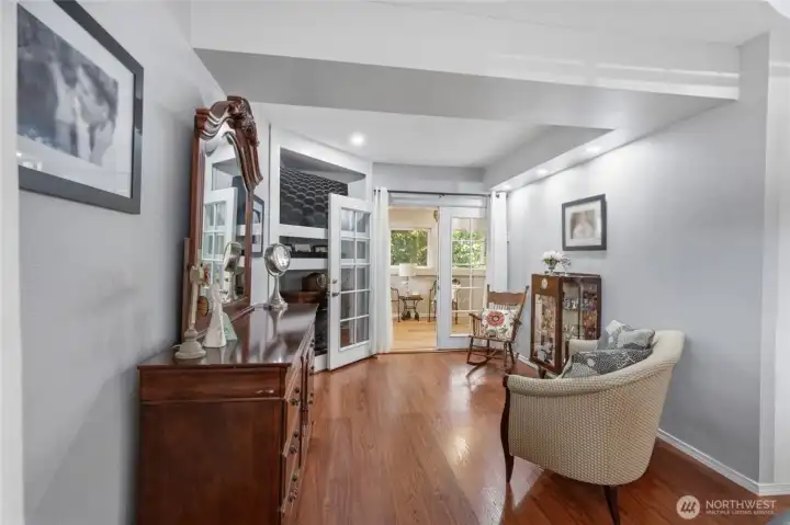 Great built in for the tv or whatever you decide. Through those doors is your very own sunroom