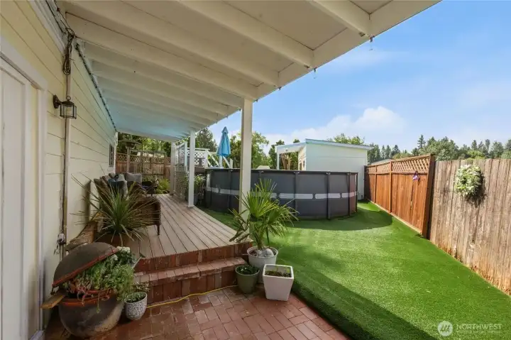 Covered patio and deck. Visit while they play in the pool