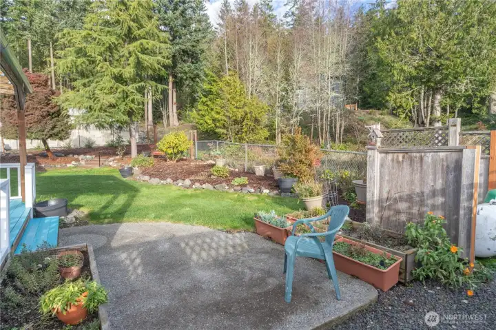 Back yard and patio area. This back yard is fenced.