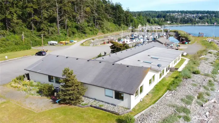 This is a bird's eye view of the Cape George Common Area including the Clubhouse, swimming pool, and marina. There is some kayak storage too.
