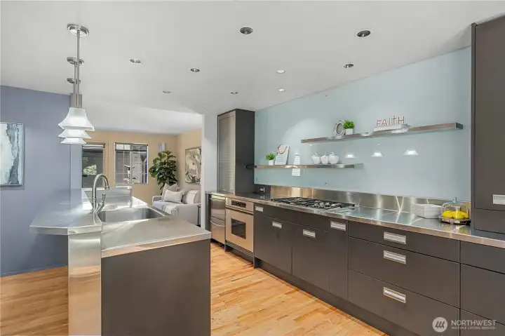High-end appliances, modern cabinetry, & generous workspace