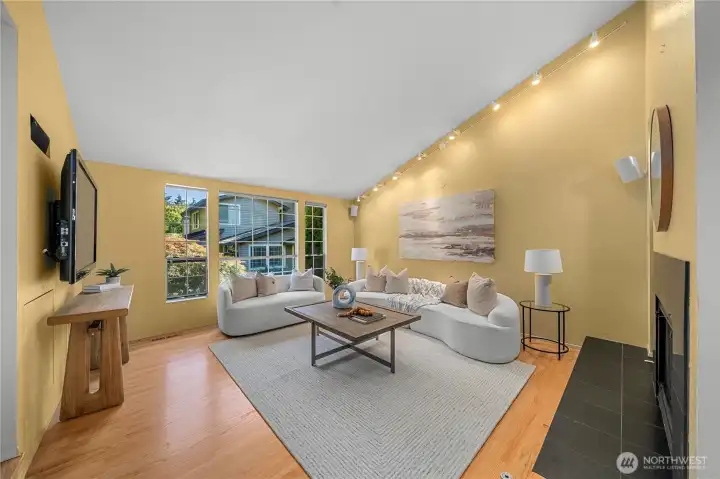 Refinished warm hardwood floors and clean contemporary lines create a sophisticated yet welcoming atmosphere