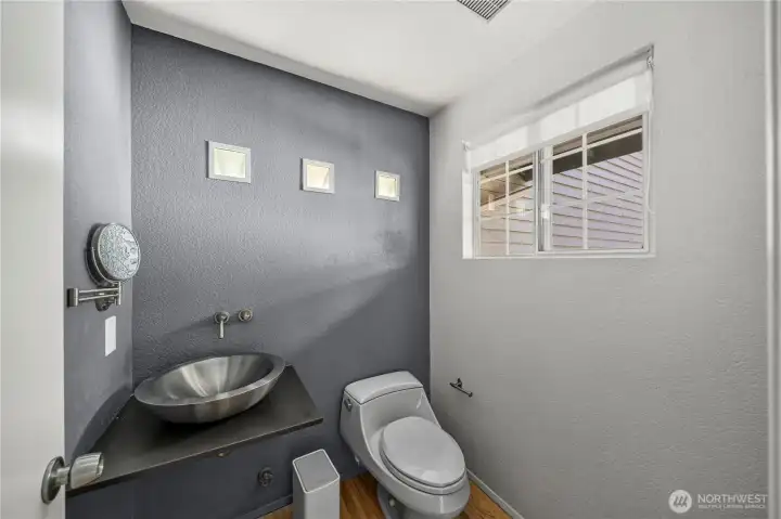 Stylishly updated powder room on main level