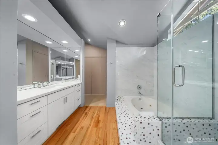 Updated spa-inspired primary bath featuring a dual-sink vanity