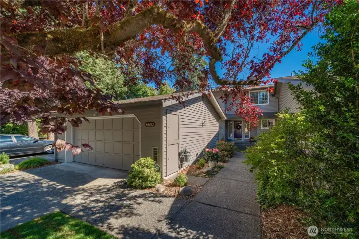 Two car garage and driveway parking spaces