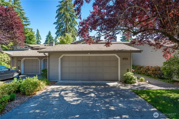 Two car garage and driveway parking spaces