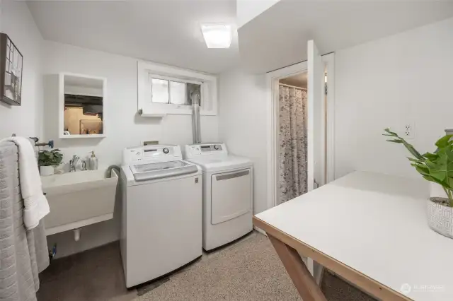 Designated laundry area w/ deep sink, additional counter space, and 3/4 bathroom attached.