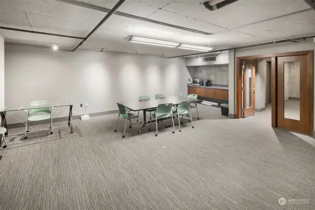 This flexible community room is ideal for hosting meetings, group work, or study sessions, offering ample seating for residents’ and guests' convenience.