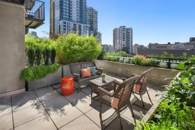 Step outside to your private oasis—this west-facing patio is ideal for entertaining, gardening, or simply enjoying the sunset over Seattle.