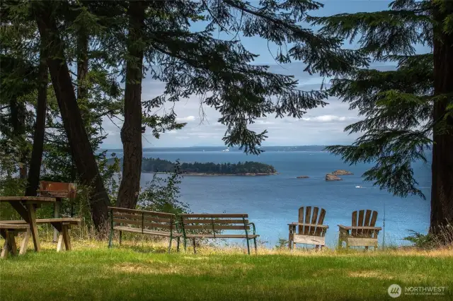 Another community area with picnic tables and benches to enjoy views toward Barnes and Clark islands. The trail to the saltwater beach is off the parking area (not pictured).