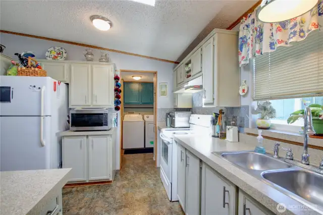 Looking from the kitchen into the laundry area.
