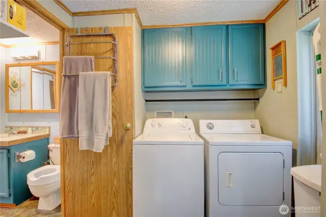 Laundry is off the kitchen and accessible to second bathroom. Door to the right leads to a porch.
