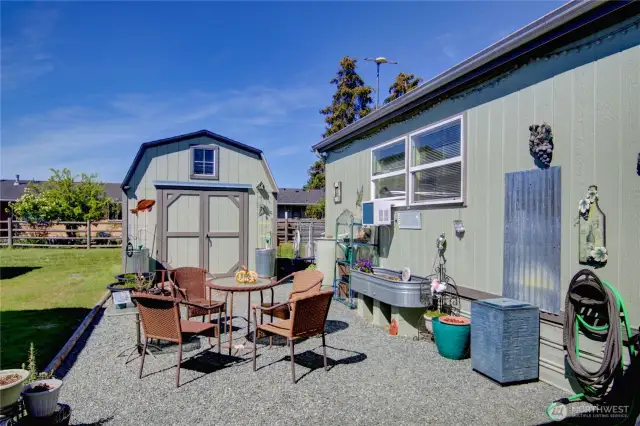 One of several garden and seating spaces. Shed for storage.