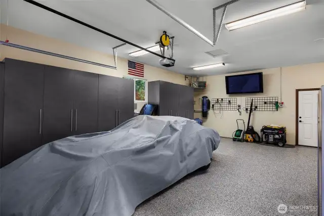 Seperated 2nd garage giving you another huge single car space with room for the workshop - heated, TV stays.