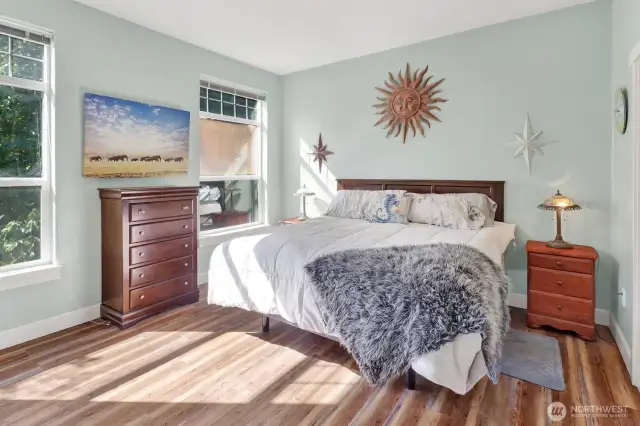The primary suite is your own oasis with updated flooring.