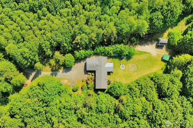 Beautiful drone shot of the property. Plenty of room for biking, hiking, exploring or future outbuildings.