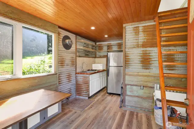 Step inside the tiny house living area and kitchen.