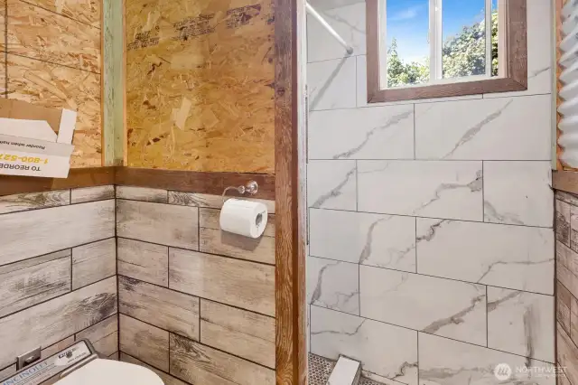 Tiny house bathroom: shower is just around the corner.