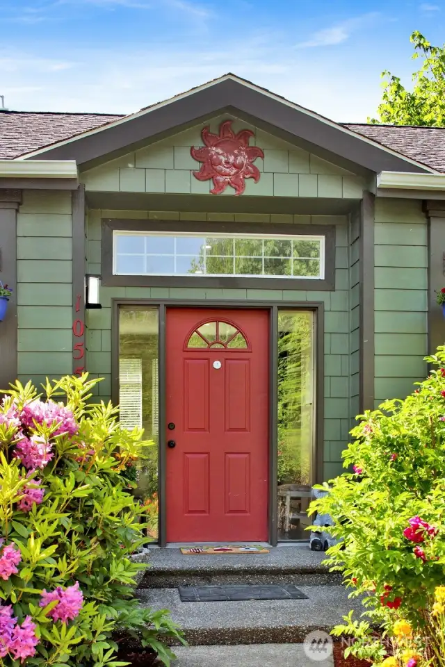 Beautiful entry with low-maintenance mature landscaping!