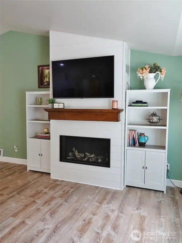 A gorgeous addition to this house....an encassed propane fireplace, which provides a focal point for the room.