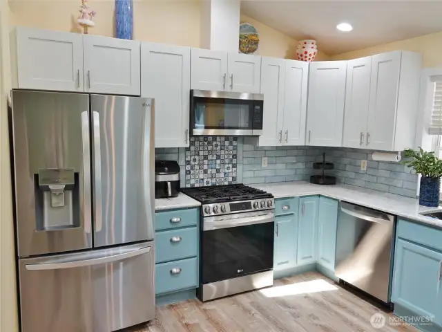 Kitchen w/ newer Stainless Steel appliances.