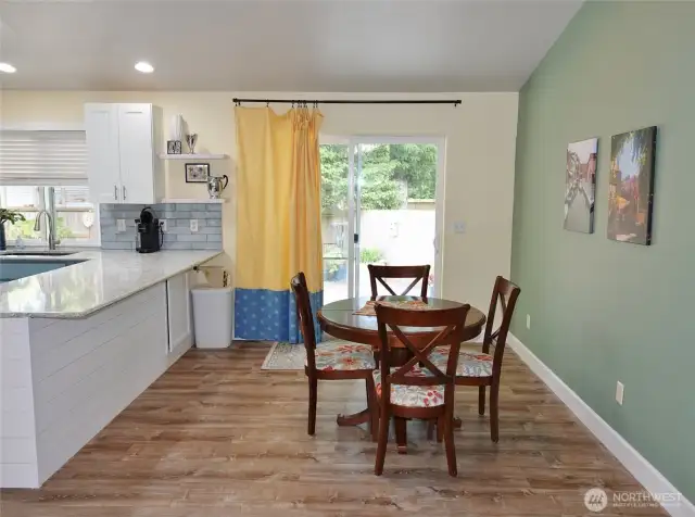 Dining Area w/ slider leading to the Rear Deck and Fenced Backyard.