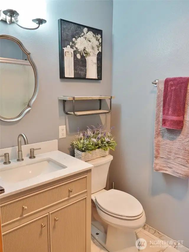 Beauifully remodeled Master Bathroom w/ vanity and tile floors.