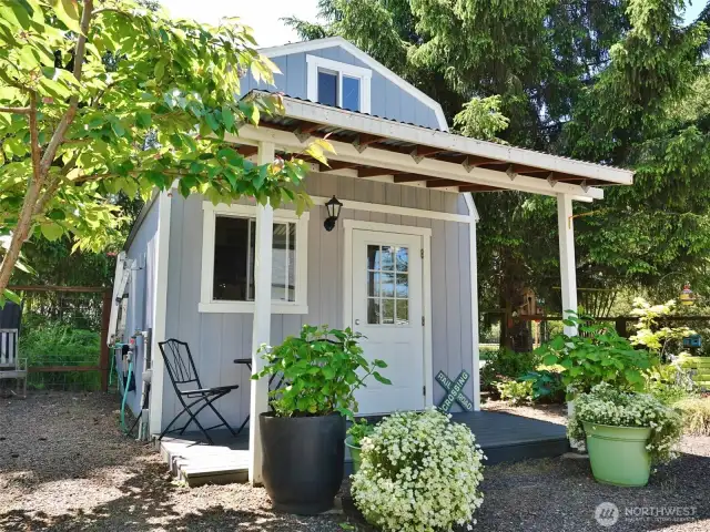 12'x16' Tuff Shed surrounded by the gorgeous landscaping.