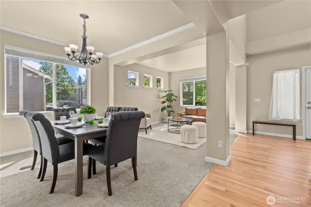 This bright and inviting front living and dining space in Puyallup’s LaGrande Station community showcases thoughtful design and timeless charm. Large front-facing windows fill the room with natural light, while the open layout offers a perfect flow for entertaining or relaxing. The formal dining area features crown molding and a modern chandelier, while the adjacent sitting room is framed by four accent windows and a picture window overlooking greenbelt views. Just off the entry with warm hardwood floors, this space offers a welcoming first impression in one of Puyallup, WA’s most desirable neighborhoods.