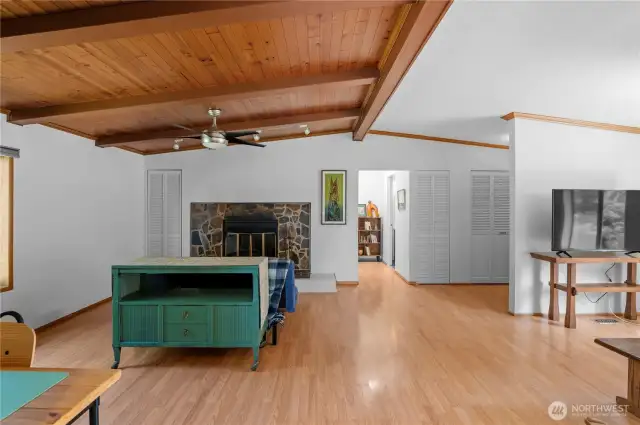 Lovely wood flooring throughout this whole main area! Easy to maintain: hit the Roomba switch and let 'er roll!