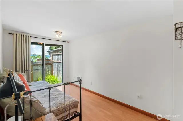 2nd bedroom has a slider to the outside with a small fenced yard that lets the dog slip out for doing his business but not get far away.
