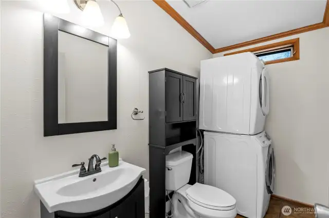 Guest half bath. You could also move the washer/dryer to the hall closet and replace them with a shower if you don't want to share...