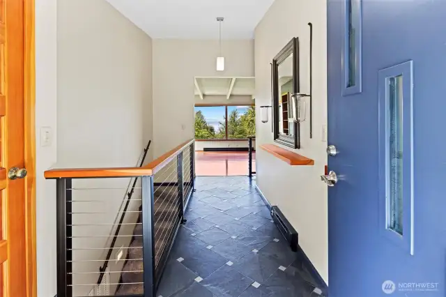 Front door entry to the living room and kitchen.  The entrance, living room and kitchen all flow as one.