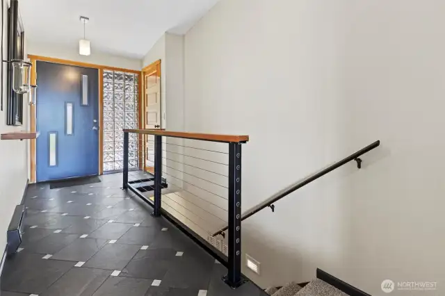 Entry that goes to front room and also stairs to go to downstairs rooms.