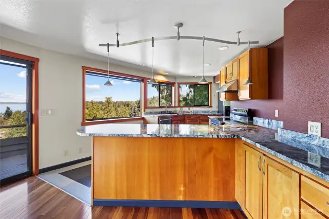 Kitchen from living room, plenty of view windows.