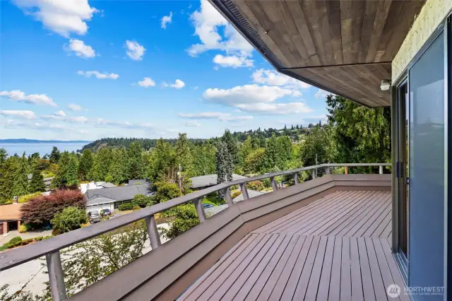 Partially covered deck off kitchen and front room.  Perfect to sit outside and just look around each day. Think of  barbecuing and taking in the daily action below and out to the Sound.