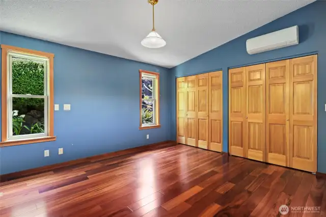 Primary bedroom, large with plenty of closet space. Hardwoods shine!