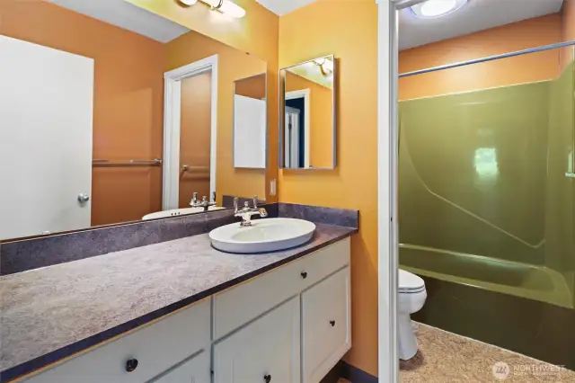 2nd bath downstairs with tub and shower.