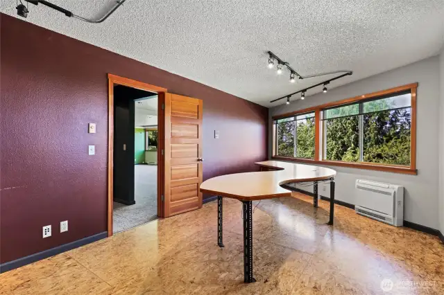 Basement office with table for whatever you plan on working on that day.