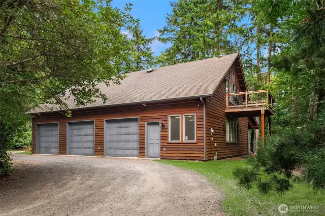 3 bay car barn located away from the main home offers large work shop area, studio apartment and hobby/storage rooms