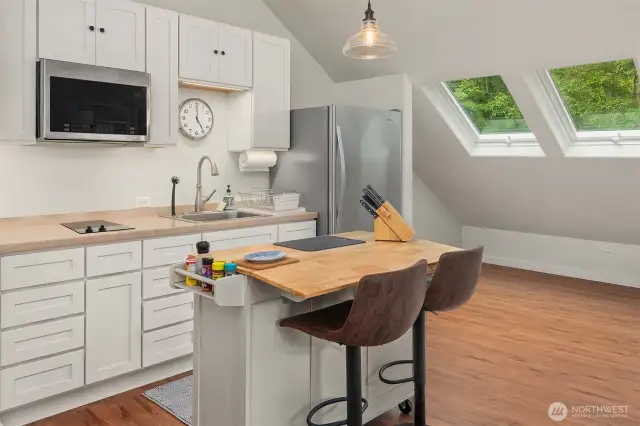Kitchen area in studio above car barn shop area …..also includes full bathroom and private deck off of small living room
