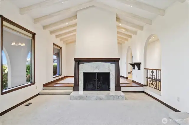 Amazing fireplace and vaulted beam ceiling in the living room