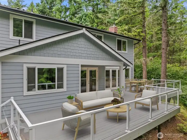 This virtual staging helps give an idea of how large the back deck is - it's plenty of space for 2 outdoor living areas