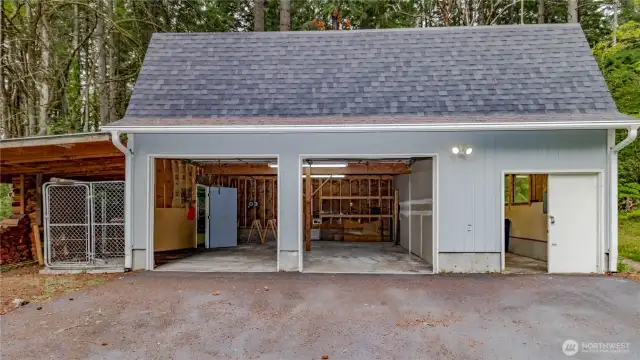2 car detached garage  features a shop space, 600 sq ft of finished space above, cords of wood and dog kennel